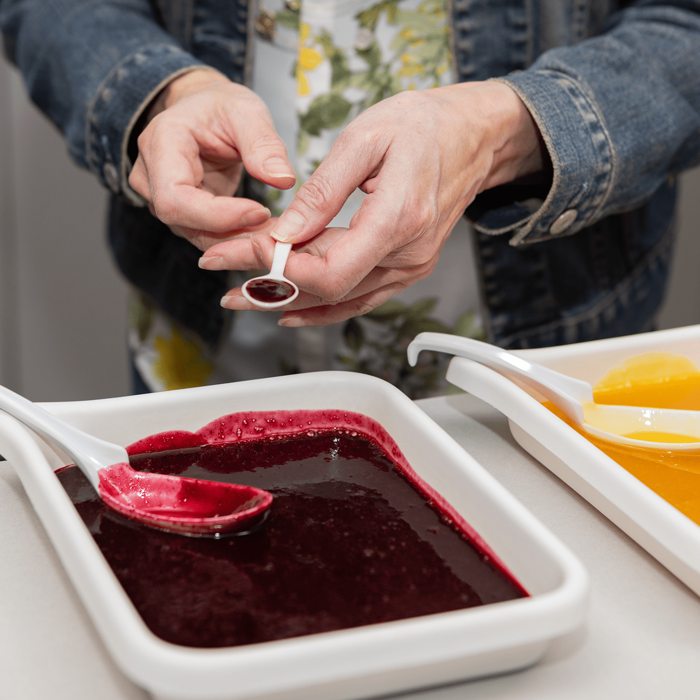 Oregon Fruit employee quality checking a puree