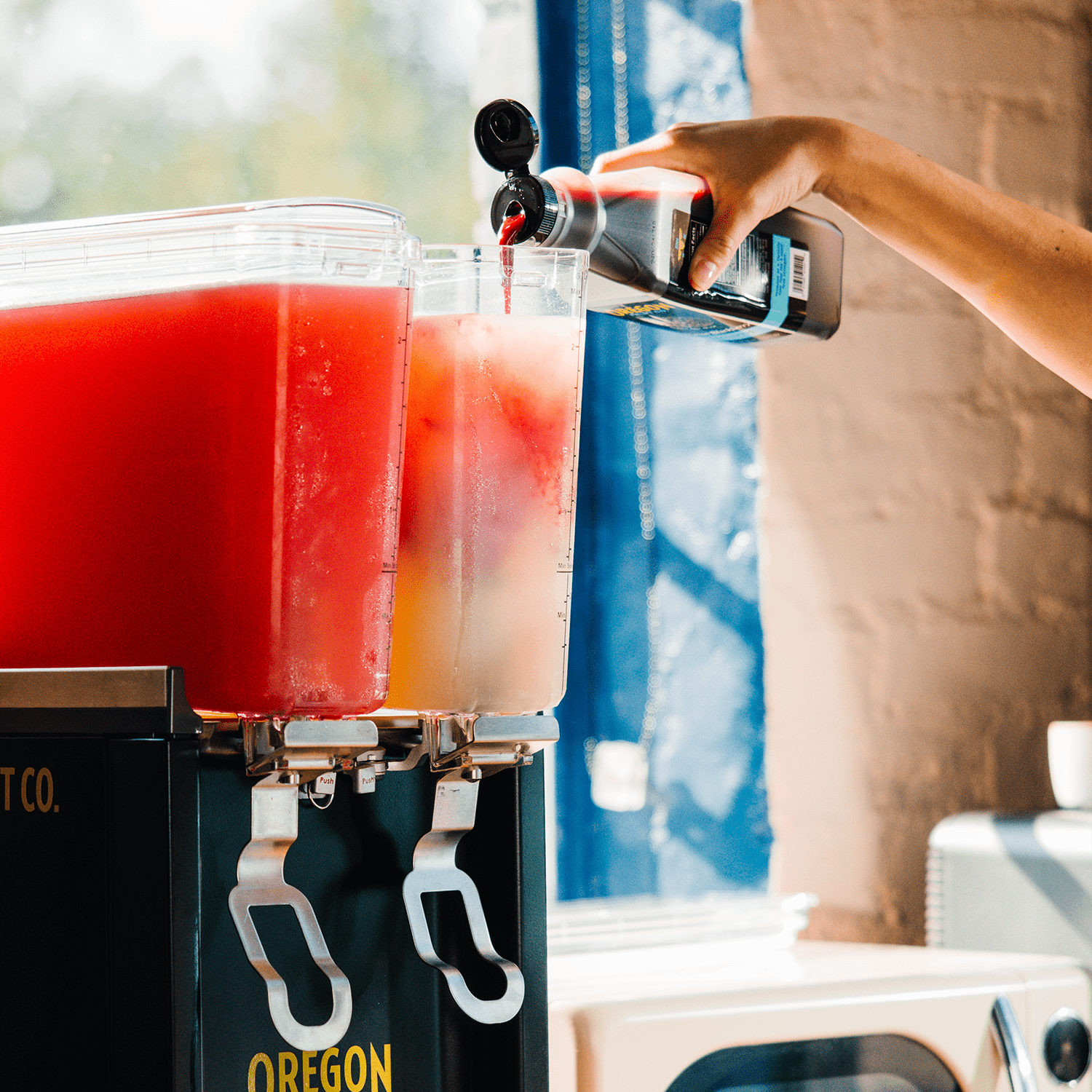Pouring Oregon Fruit Pourable Fruit into a fruit drink