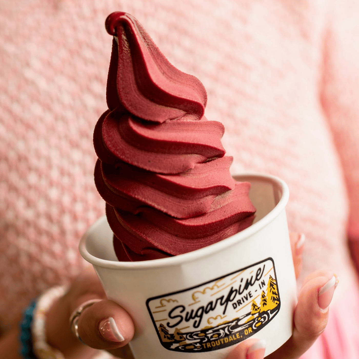a sugarpine drive in cup filled with fruity soft serve ice cream