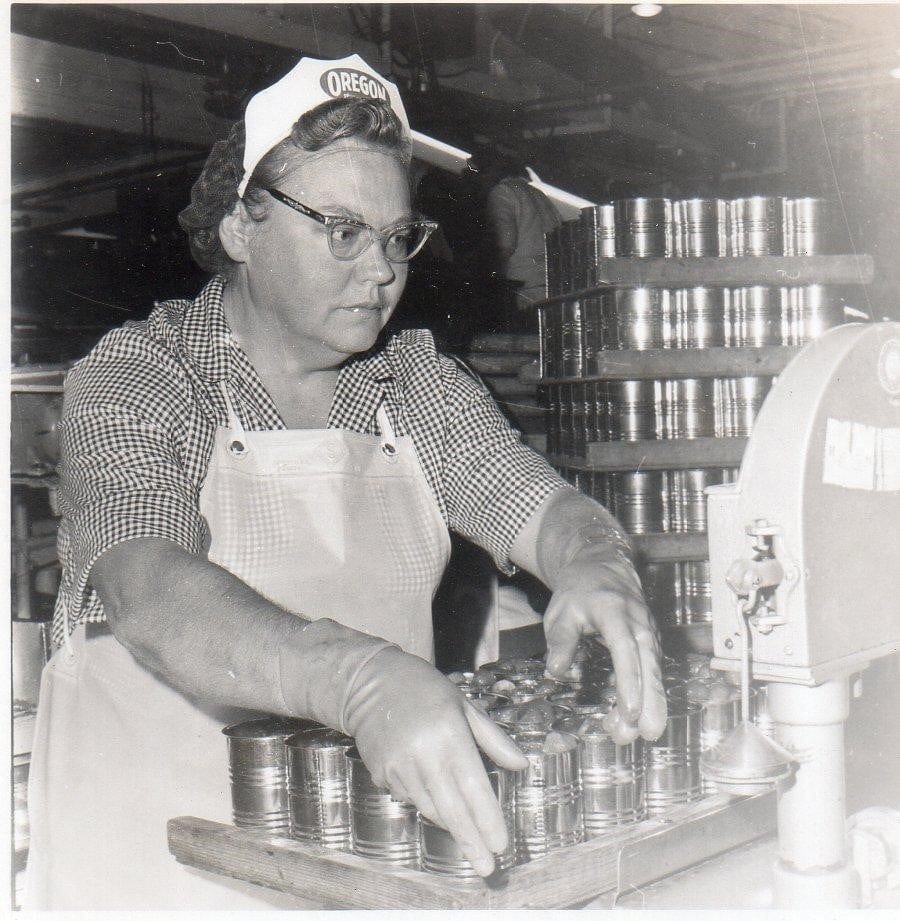 Historic photo of an Oregon Fruit employee working on the assembly line