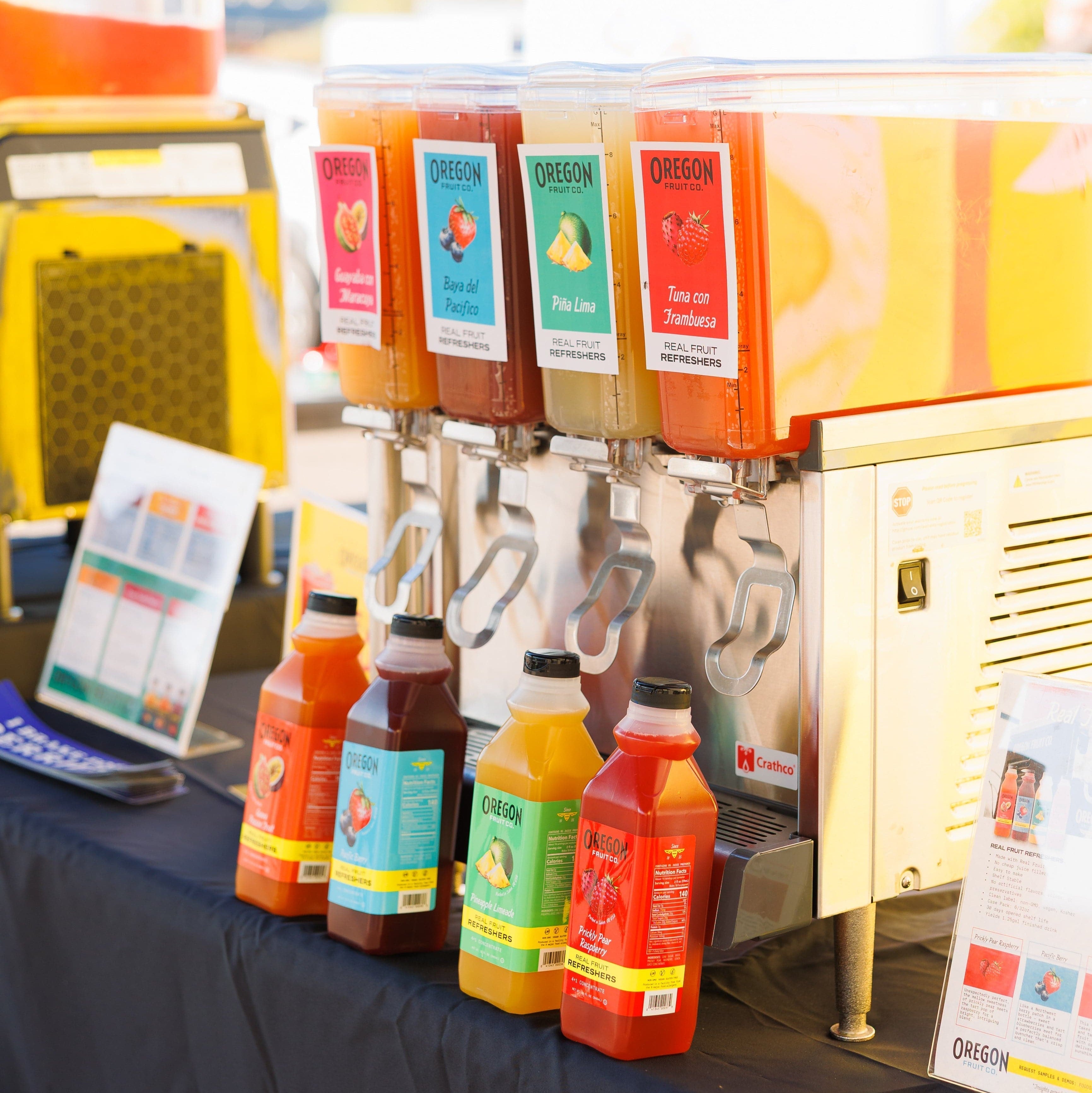 4 drink bubblers filled with colorful fruit refreshers