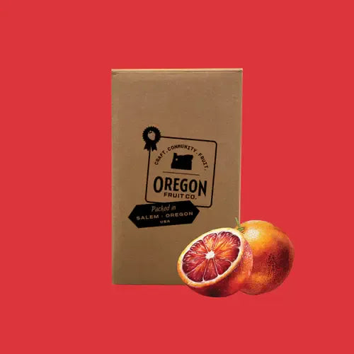 Blood Orange Fruit Puree packaging with a blood orange on a red background 