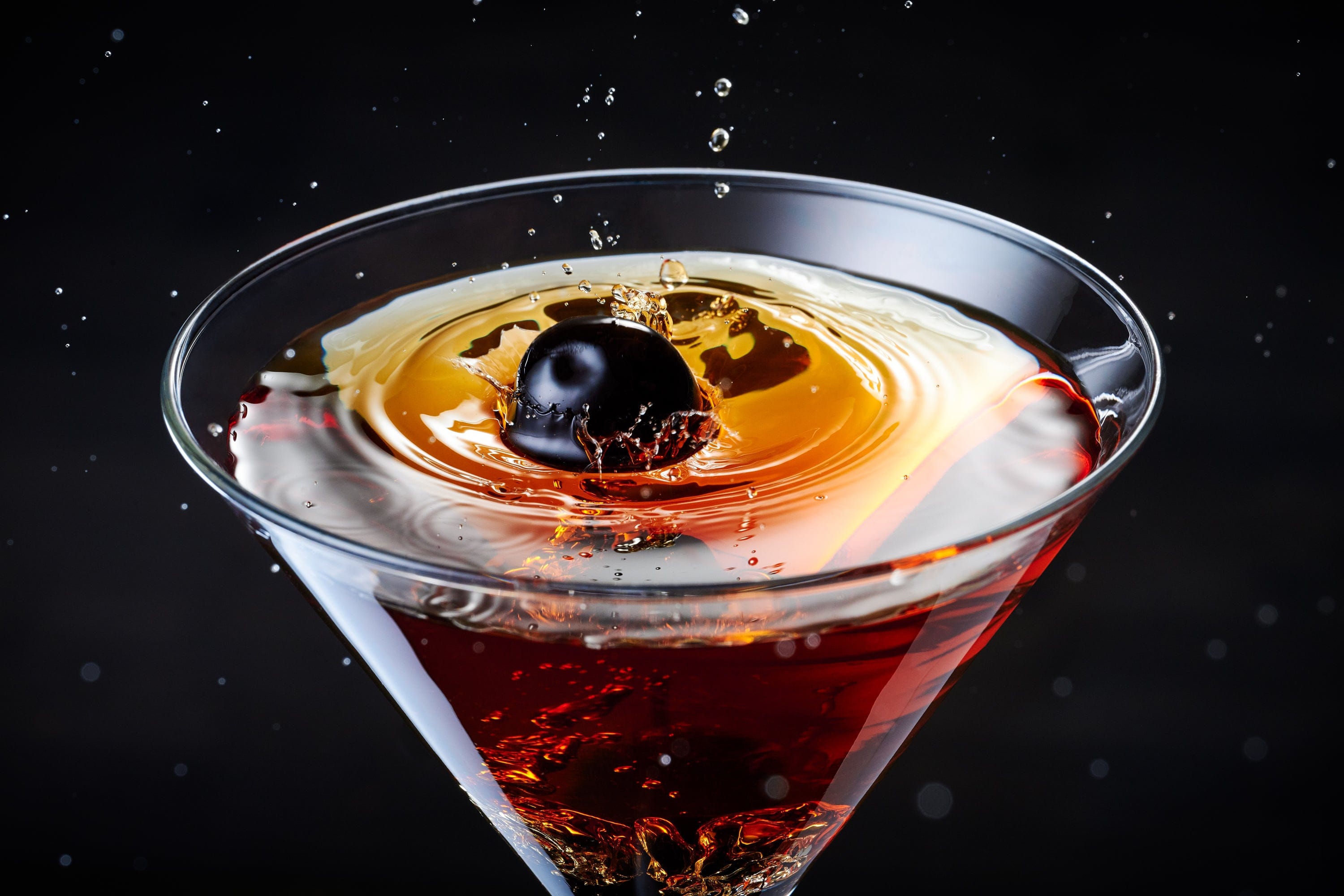 A manhattan cocktail with an Oregon Fruit cocktail cherry 
